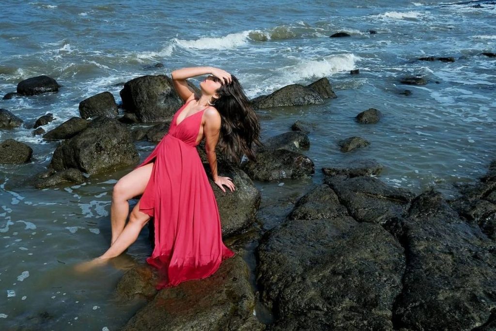 Premium Photo | Casual joyful pretty girl side pose on beach indian  pakistani model