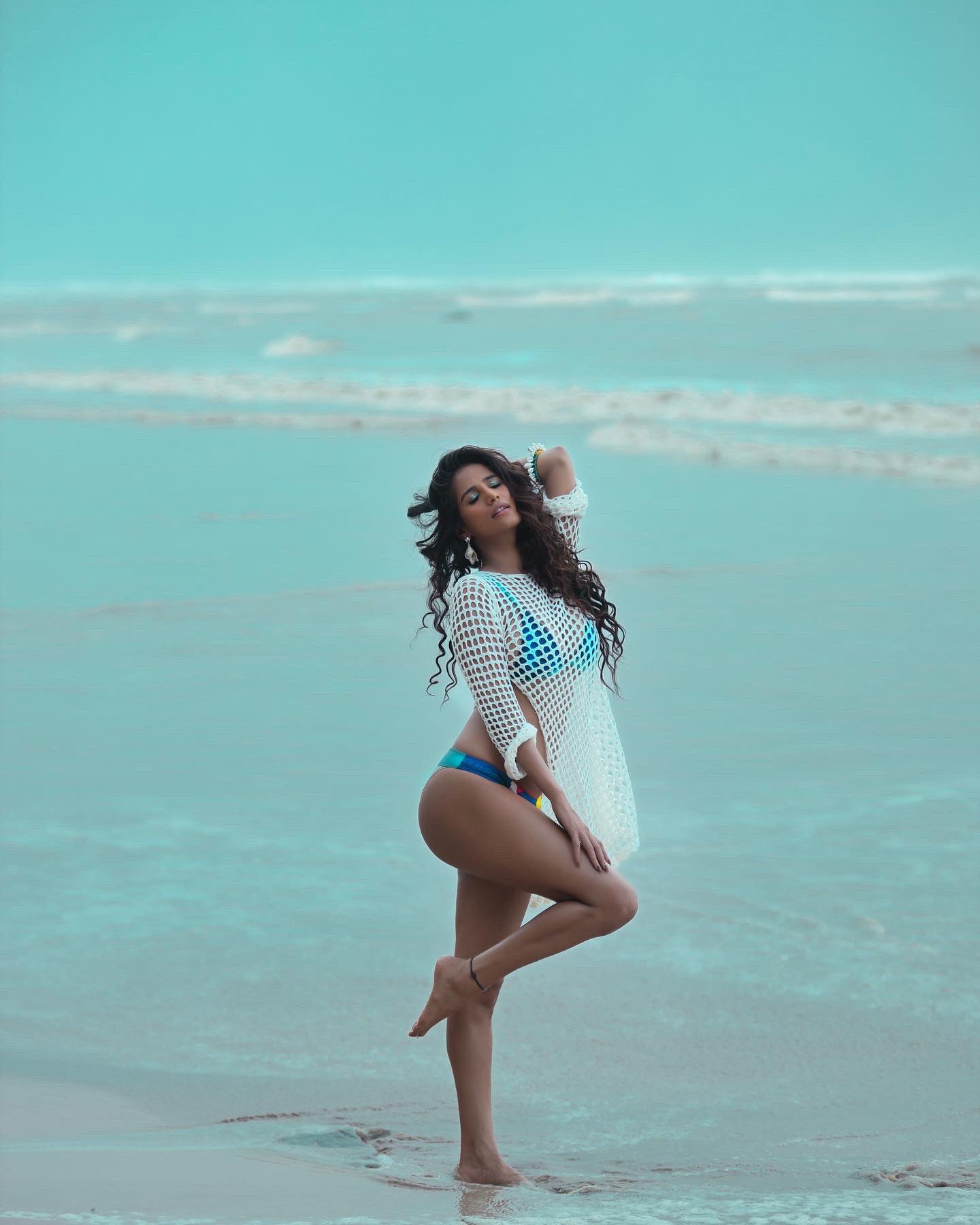 Woman doing Vajrasana pose at beach stock photo (238416) - YouWorkForThem